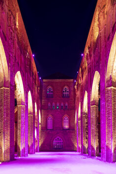 During the night-time darkness, the ruins are illuminated in shadowy purples, pinks and blues. 